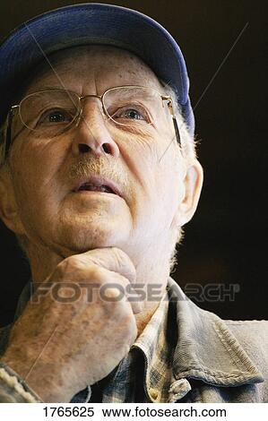 Stock Photography - Senior deep in thought. Fotosearch