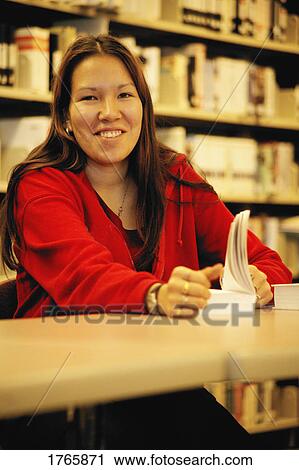 Stock Image - Student in the library. Fotosearch