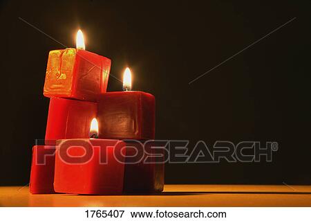 Stock Photo - Three red candles. Fotosearch