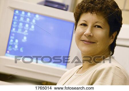 Woman at computer View Large Photo Image Picture - Woman at computer. Fotosearch