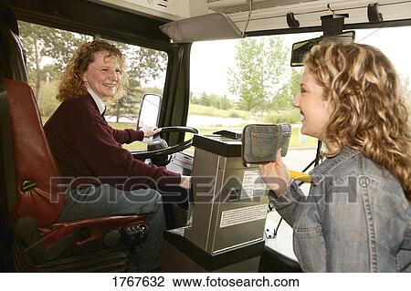 Woman enters a public bus View Large Photo Image Stock Image - Woman enters a public bus. Fotosearch