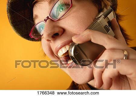 Stock Photo - Woman on cell phone. Fotosearch