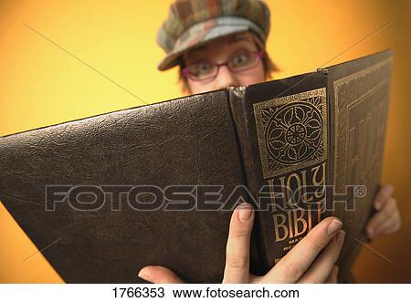 Stock Image - Woman reads Bible. Fotosearch