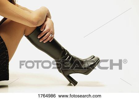 Stock Photograph - Woman with boots. Fotosearch
