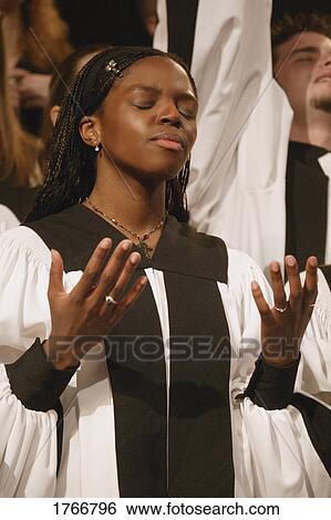 Stock Photograph - Worshipping in a choir. Fotosearch