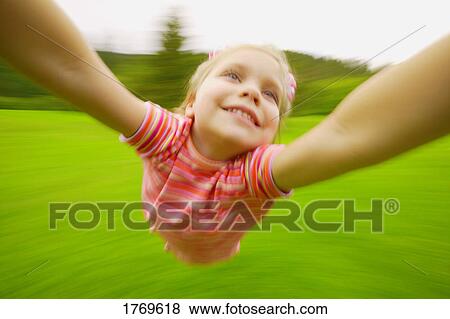 Stock Photo - A child hangs on. Fotosearch
