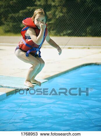 A child jumps off diving board View Large Photo Image Stock Image - A child jumps off diving board. Fotosearch