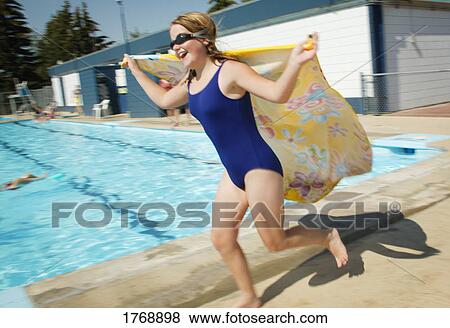 A child runs by a pool View Large Photo Image Stock Photo - A child runs by a pool. Fotosearch