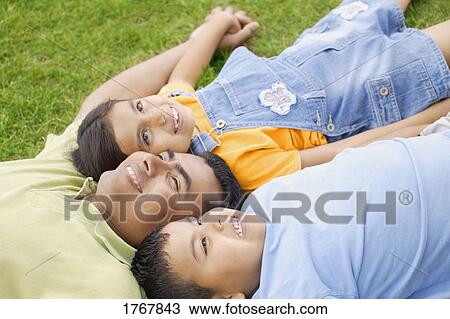 A family together outside View Large Photo Image Stock Image - A family together outside. Fotosearch