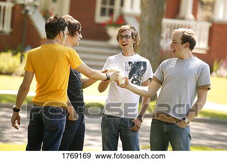 A group of guys drinks milk View Large Photo Image Stock Photo - A group of guys drinks milk. Fotosearch
