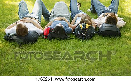 A group of young people napping View Large Photo Image Stock Image - A group of young people napping. Fotosearch