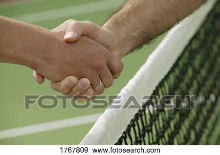Stock Photo - A handshake before a tennis game. Fotosearch