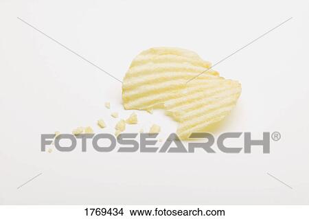 Picture - A potato chip with a bite. Fotosearch