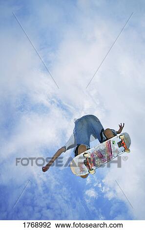 A skateboarder in action View Large Photo Image Stock Image - A skateboarder in action. Fotosearch