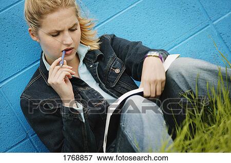 A student doing homework View Large Photo Image Stock Photo - A student doing homework. Fotosearch