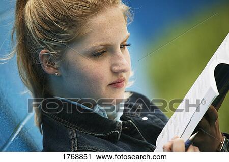 Stock Image - A student reads. Fotosearch