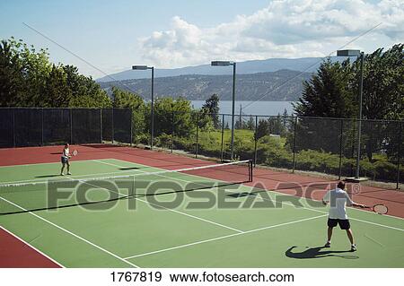 Stock Photo - A tennis game. Fotosearch