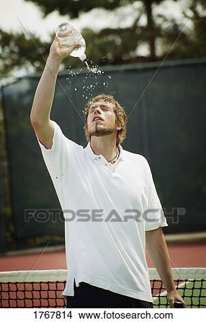 A tennis player cools off View Large Photo Image Picture - A tennis player cools off. Fotosearch