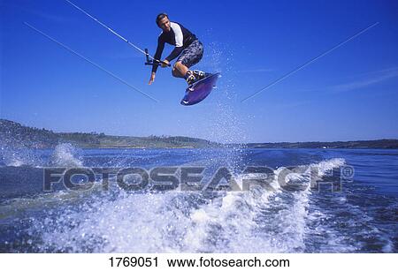 Stock Image - A wake boarder jump. Fotosearch