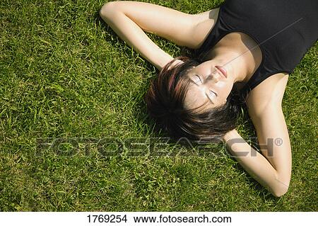A woman sleeping View Large Photo Image Picture - A woman sleeping. Fotosearch