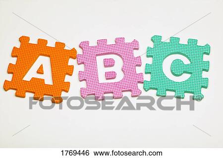 Stock Photograph - Alphabet foam pieces. Fotosearch
