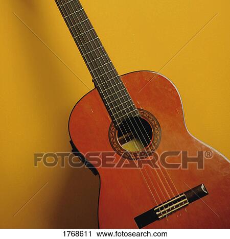 An acoustic guitar View Large Photo Image Stock Image - An acoustic guitar. Fotosearch