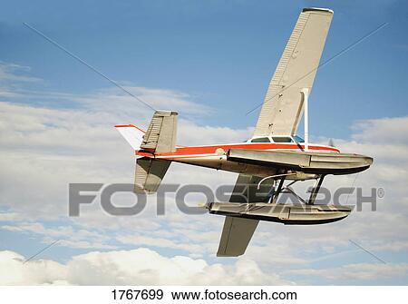 Stock Photo - An airplane in the sky. Fotosearch