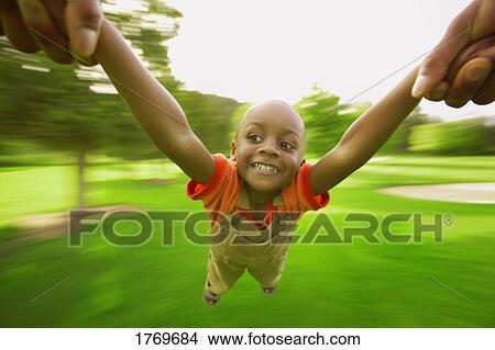 Boy spinning View Large Photo Image Picture - Boy spinning. Fotosearch