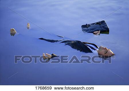 Stock Photo - Businessman dead in the water with briefcase. Fotosearch