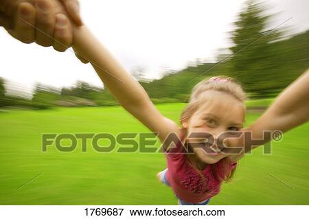 Stock Photo - Child flying in the air. Fotosearch