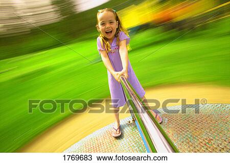 Child on a merry-go-round View Large Photo Image Stock Image - Child on a merry-go-round. Fotosearch