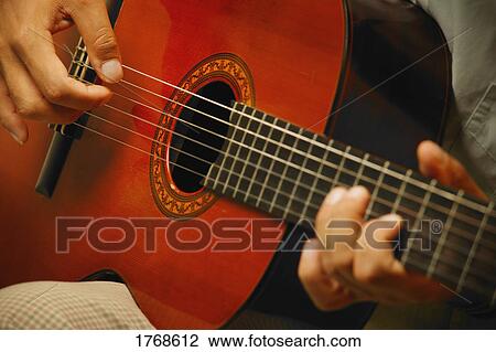 Stock Image - Closeup of a guitar. Fotosearch