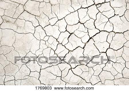 Cracked dried earth View Large Photo Image Stock Image - Cracked dried earth. Fotosearch