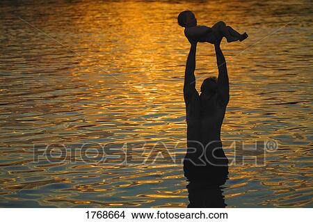 Dedicating a child View Large Photo Image Picture - Dedicating a child. Fotosearch