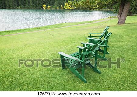 Empty chairs in a park View Large Photo Image Stock Photo - Empty chairs in a park. Fotosearch