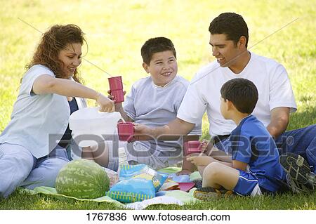 Family enjoys a picnic View Large Photo Image Stock Photograph - Family enjoys a picnic. Fotosearch