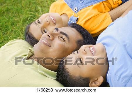 Stock Image - Family together outside. Fotosearch