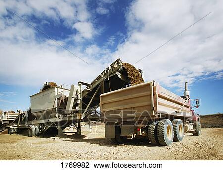 Filling a dump truck View Large Photo Image Stock Image - Filling a dump truck. Fotosearch