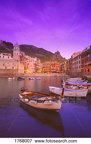 fishing boats in the harbor near buildings of Vernazza Cinque Terre Italy View Large Photo Image Stock Photo - fishing boats in the harbor near buildings of Vernazza Cinque Terre Italy. Fotosearch