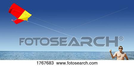 Stock Image - Flying a kite. Fotosearch