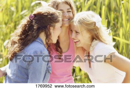 Stock Image - Giggling girls. Fotosearch