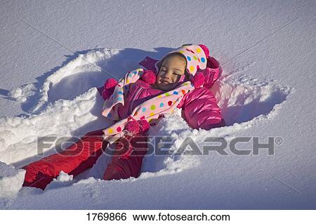 Girl making snow Angel View Large Photo Image Stock Photograph - Girl making snow Angel. Fotosearch