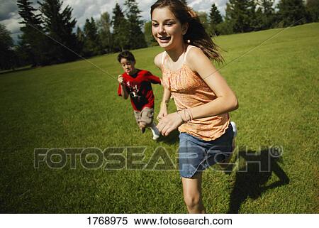 Girl runs from boy View Large Photo Image Stock Photography - Girl runs from boy. Fotosearch