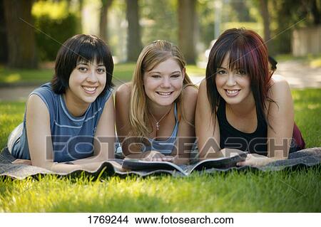 Group of girls with a book View Large Photo Image Picture - Group of girls with a book. Fotosearch