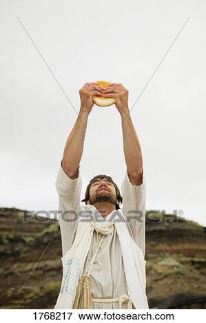 Stock Photo - Jesus breaks bread. Fotosearch