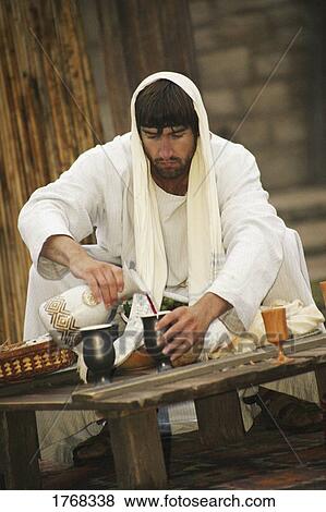 Jesus pours a drink View Large Photo Image Stock Photo - Jesus pours a drink. Fotosearch