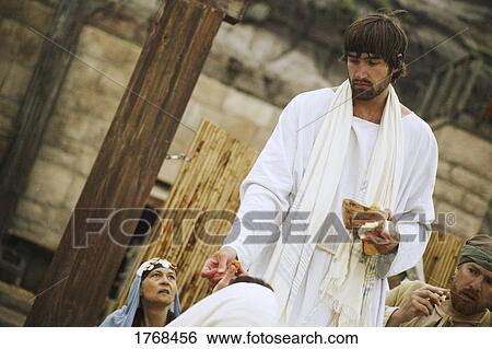 Stock Photograph - Jesus shares bread. Fotosearch