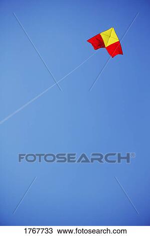 Stock Image - Kite flying in a sky. Fotosearch