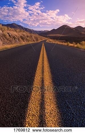 long straight road with a bend View Large Photo Image Stock Image - long straight road with a bend. Fotosearch