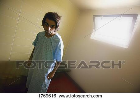 Man in a small room View Large Photo Image Stock Photograph - Man in a small room. Fotosearch